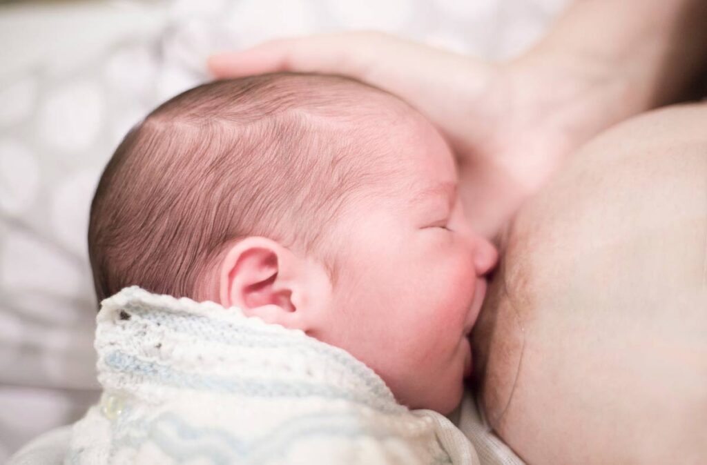 baby nursing using a nipple shield